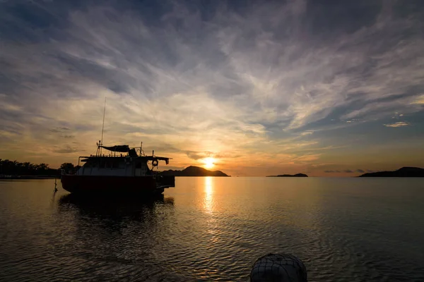 Twilight Morning Light with Silhouette boat at Rawai beach Phuket Thailand.