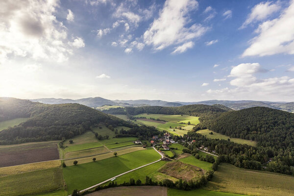 Aerial Shot of picturesque landscape of the Vienna Woods in Lower Austria with little village Untermeierhof