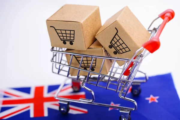 Box with shopping cart logo and New Zealand flag : Import Export Shopping online or eCommerce delivery service store product shipping, trade, supplier concept.