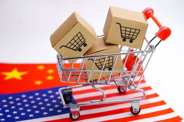 Box with shopping cart logo and USA and China flag : Import Export Shopping online or eCommerce delivery service store product shipping, trade, supplier concept.