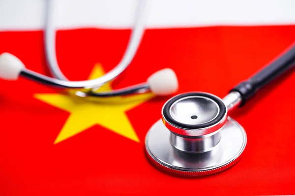 Black stethoscope on China flag background.