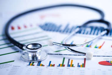Stetoskop, Grafikler ve Grafikler elektronik tablo kağıdı, Finans, Hesap, İstatistik, Yatırım, Analitik araştırma veri ekonomisi elektronik tablosu ve İşletme şirketi konsepti