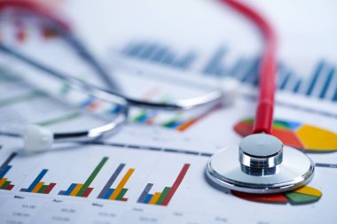 Stetoskop, Grafikler ve Grafikler elektronik tablo kağıdı, Finans, Hesap, İstatistik, Yatırım, Analitik araştırma veri ekonomisi elektronik tablosu ve İşletme şirketi konsepti