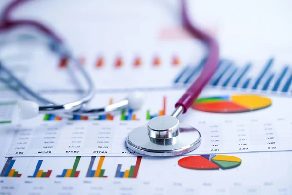 Stethoscope, Charts and Graphs spreadsheet paper, Finance, Account, Statistics, Investment, Analytic research data economy spreadsheet and Business company concept