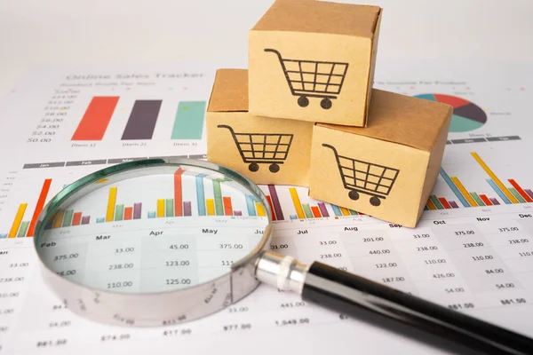 Shopping cart logo on box with magnifying glass on graph background. Banking Account, Investment Analytic research data economy, trading, Business import export transportation online company concept.