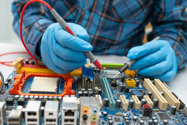 Technician repairing micro circuit main board computer electronic technology, hardware, mobile phone, upgrade, cleaning concept.