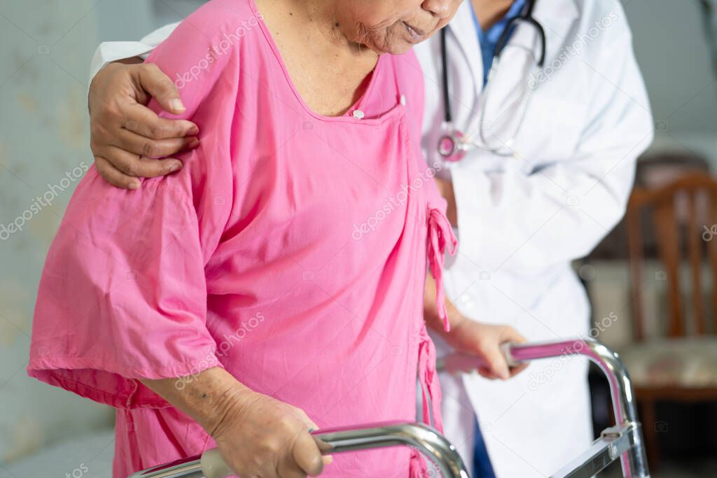 Asian senior or elderly old lady woman patient walk with walker at nursing hospital ward : healthy strong medical concept