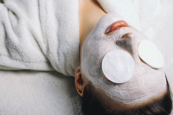 woman with face mask in spa