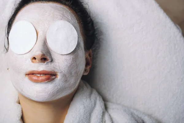 woman with face mask in spa