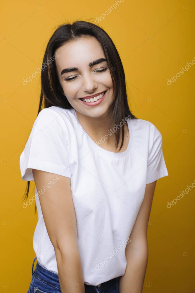 Portrait of a lovely attractive girl being happy with closed eye