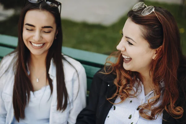 Close up portrait of a plus size women laughing while sitting on