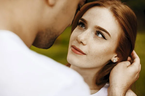 Close up of a beautiful woman with red hair and freckles looking — Stock Photo, Image