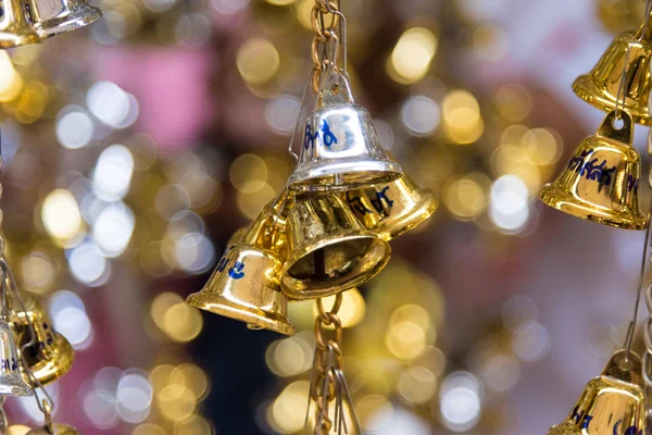 Golden and Bronze Bell is buddhist culture and  praying for good luck in life at Rai Khing Temple Nakhon Pathom Thailand.