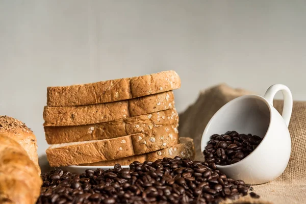 Bread Croissant Sackcloth Empty Coffee Cup Coffee Beans — Stock Photo, Image