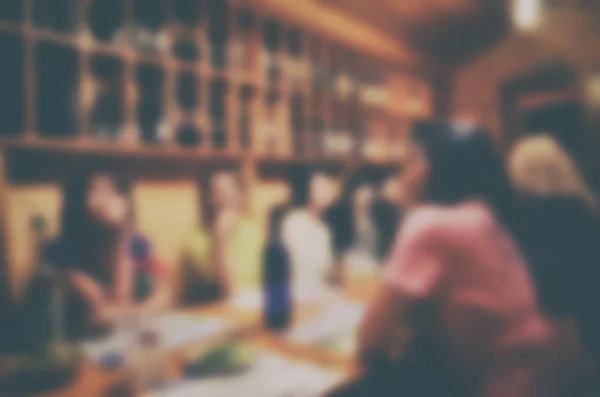 Blurred tourist group in restaurant and cafe for order and dinner in the evening. Blurred Background Concept.