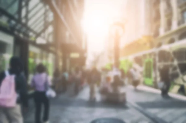 People meeting and walking on the street in the city and outdoor restaurant space, business and lifestyle with building and city. Blurred Background Concept.