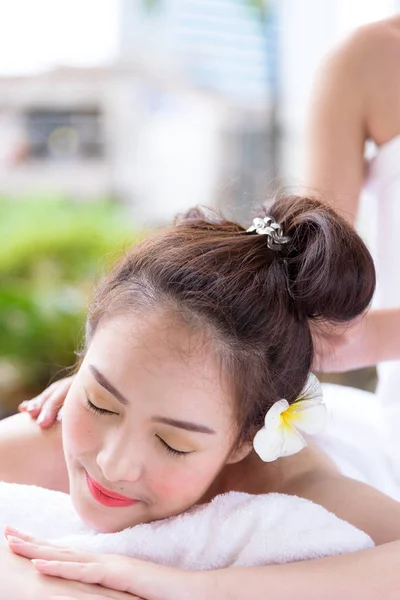 Portrait of beautiful asian people with close up view and close up eyes and having hand massage in spa salon. Beauty, healthy, spa and relaxation concept.