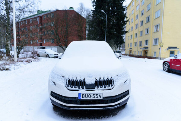 Editorial: Helsinki City, Finland, 21th December 2018. Car on the road in village with snow and winter season at Helsinki, Finland.