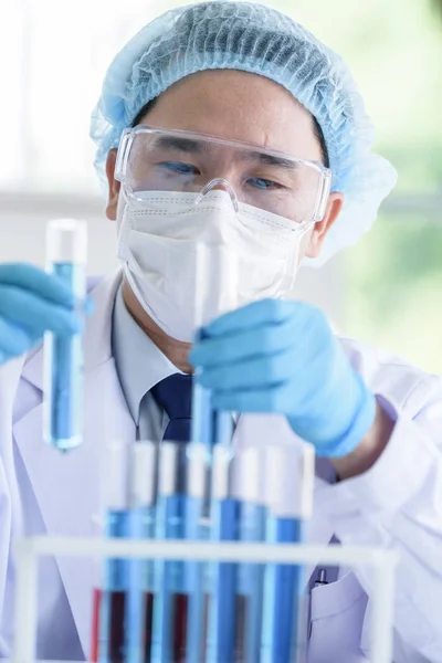 Asian man scientist researching  and learning in a laboratory. Stock Image