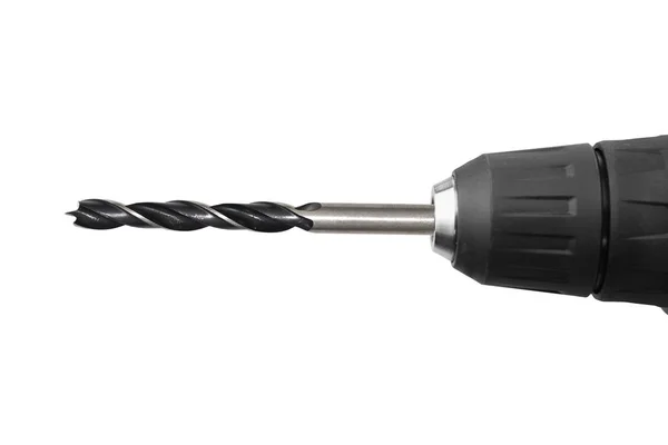 Black drill bit in the drill  closeup on white background isolated — Stock Photo, Image