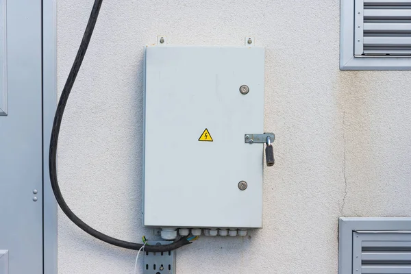 Electric panel on the grey wall