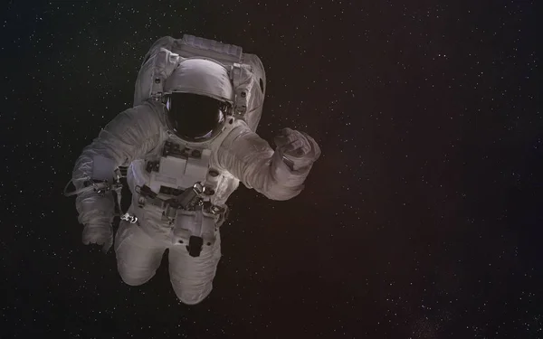 太空中的单身宇航员。这张图片的元素是由美国宇航局提供的. — 图库照片