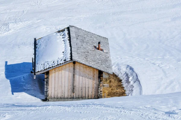 Cabin wood in the snow mountains in winter, Switzerland