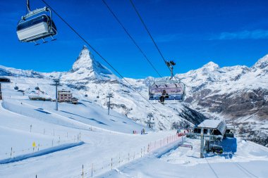 Zermatt, Switzerland MARCH 25, 2017: Skier in Cable car to Matterhorn Glacier Paradise at Zermatt, Switzerland clipart