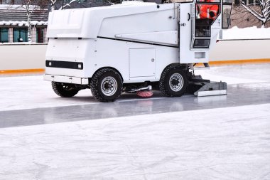 Ice resurfacer to clean and smooth the surface of a sheet of ice rink clipart