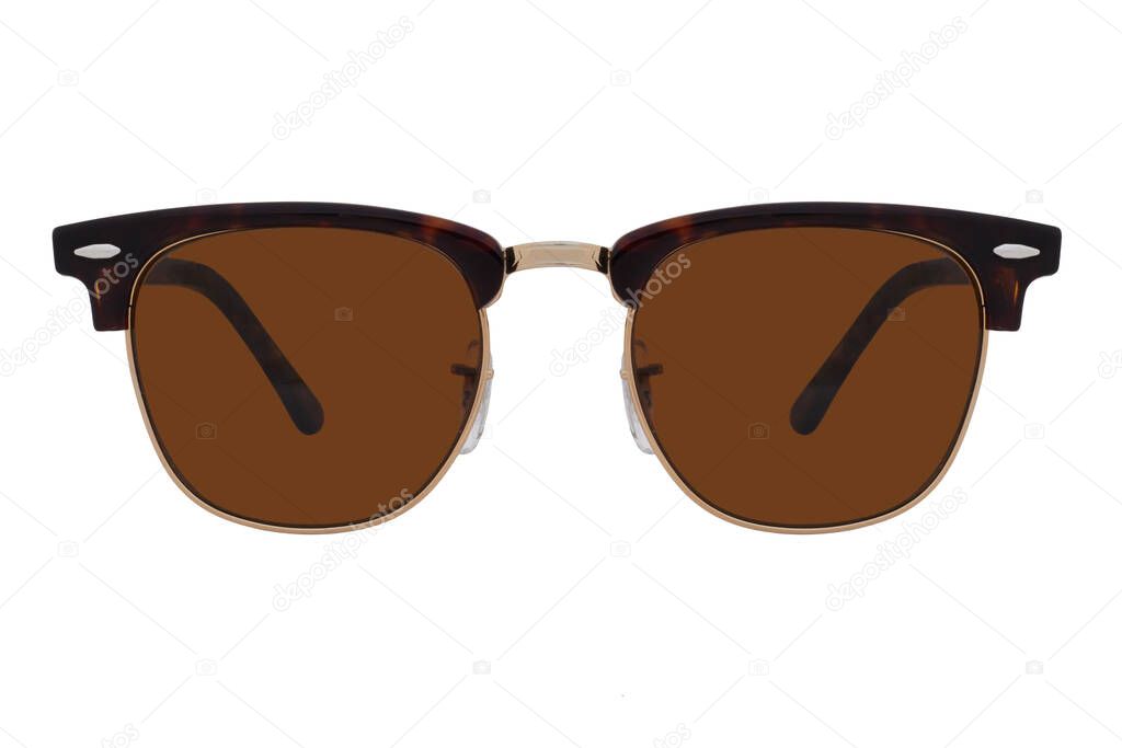 Sunglasses with a gold frame and brown lenses isolated on white background.