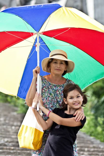 Happy Grandmother Granddaughter Big Colorful Umbrella — Stock Photo, Image