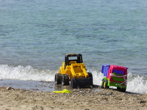 Abandoned plastic toys at a beach