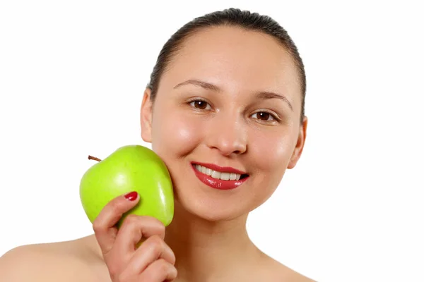 Young beautiful smiling woman touches the apple to face. isolated on white. Royalty Free Stock Photos