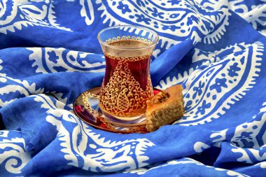 Traditional Armudu (tea cup) with Pakhlava and Kelaghayi (scarf)  clipart