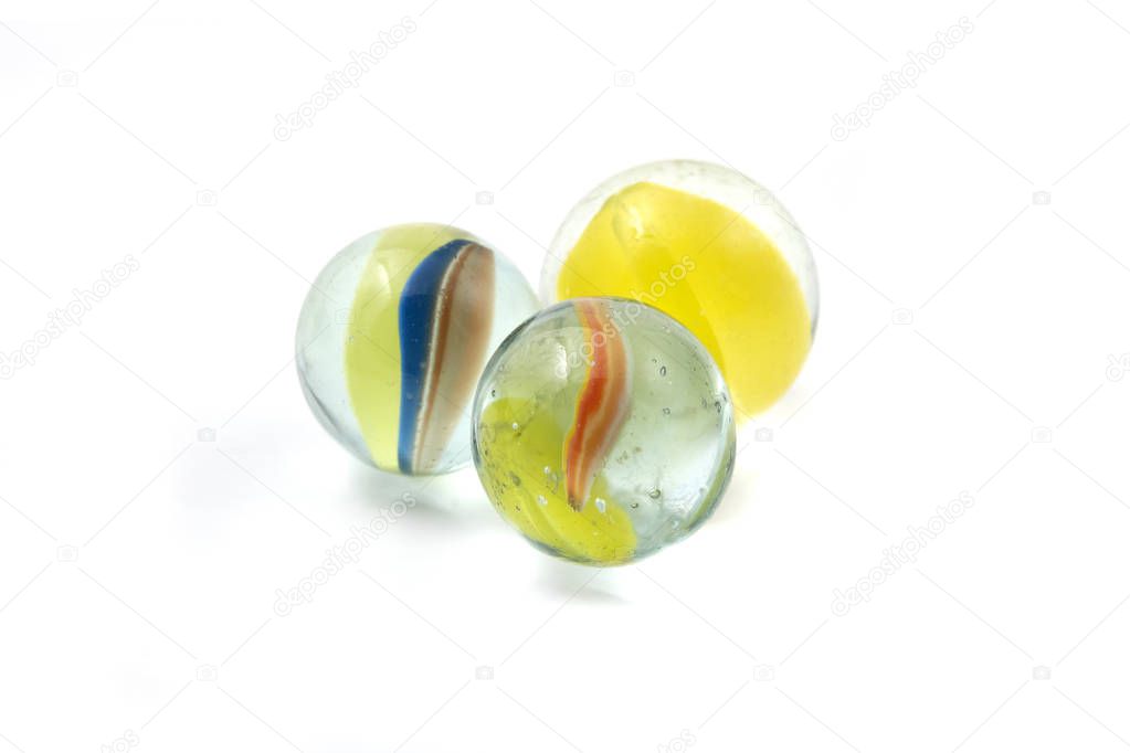 Glass catseye marbles on a white background