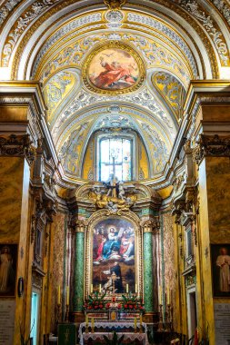 Main altar with altarpiece of Christ and Saints Stanislaus & Hyacinth at Santo Stanislao dei Polacchi, Rome, Italy.