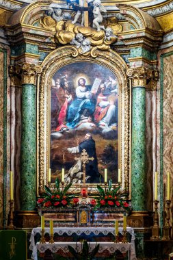 Main altar with altarpiece of Christ and Saints Stanislaus & Hyacinth at Santo Stanislao dei Polacchi, Rome, Italy.