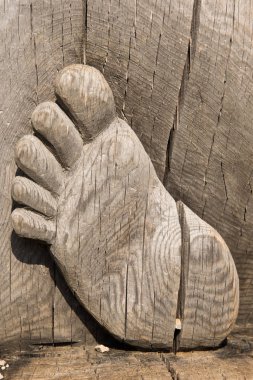 close - up of feet carved from wood clipart