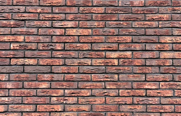 A wall of red, old brick. Background, texture and concept.