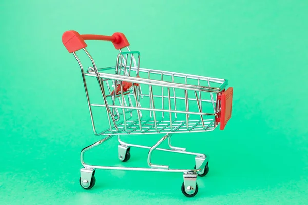 Reduced Copy Shopping Cart Supermarkets Green Background Concept Shopping Grocery — Stock Photo, Image