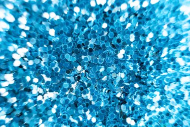 Şenlikli parlak arka plan: mavi parıltılar yakın plan. Güzel koyu renk ve taşkınlık. Parti konsepti. Metin için yer.