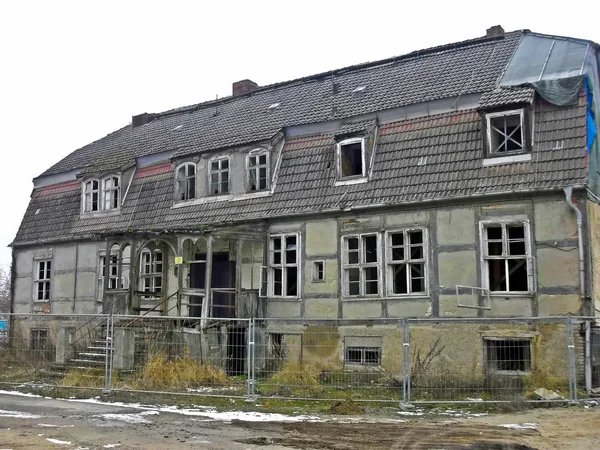 A crumbled historic half-timbered building of a city