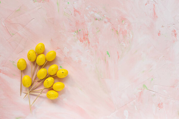 Easter sticks for appetizers on a pink background.