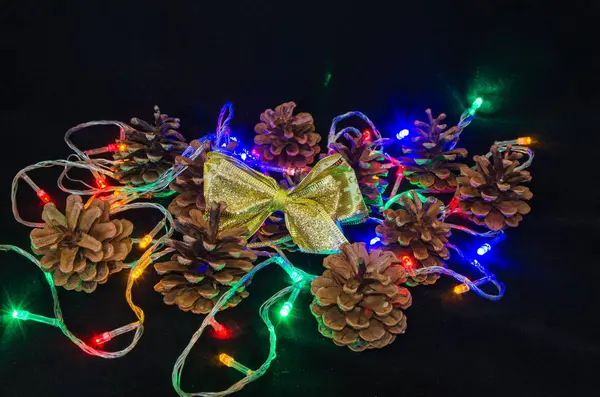 Christmas Tree Garland Pine Cone Christmas Tree Butterfly Candle Black — Stock Photo, Image