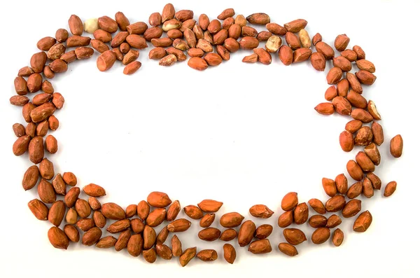 Eine Vielzahl Liegender Erdnüsse Auf Weißem Hintergrund — Stockfoto