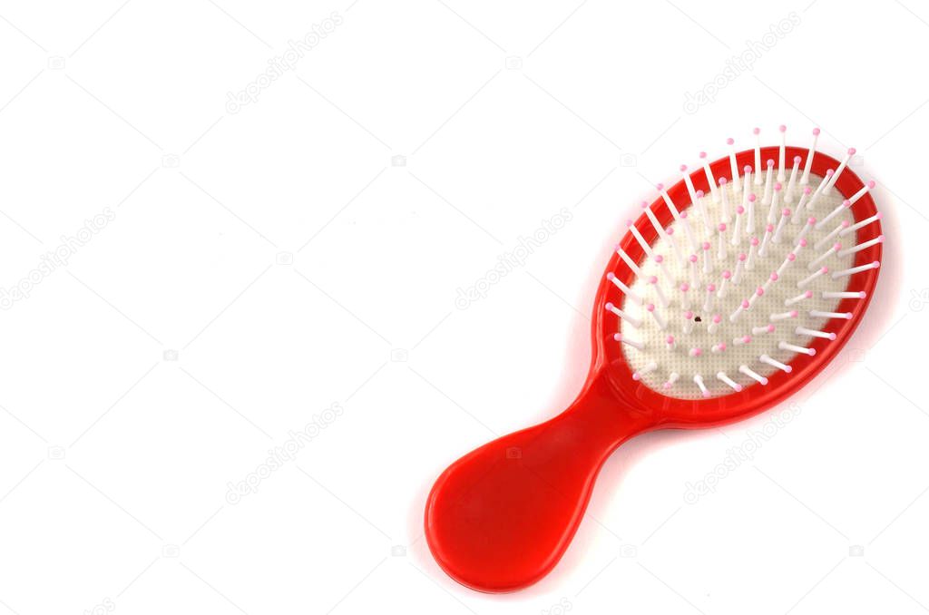 Elegant red hair comb brush with handle, isolated on transparent or white background. Front view.