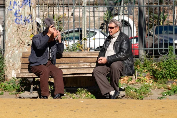 Sicily Italy January 2016 Two Men Sit Talking Each Other Royalty Free Stock Images