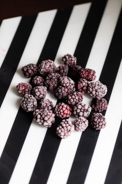 Frozen blackberry on black and white background — Stock Photo, Image