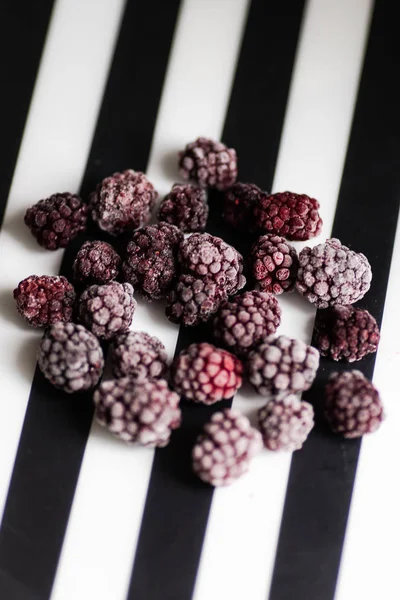 Frozen blackberry on black and white background — Stock Photo, Image