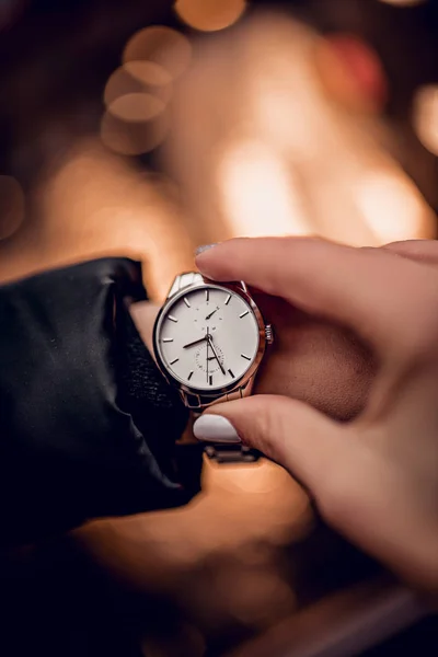 Stylish silver watch on woman hand